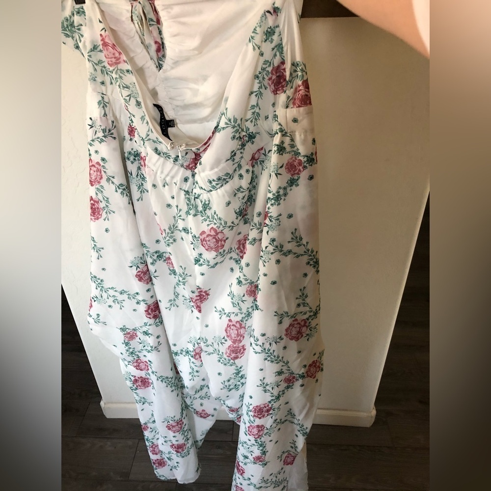 Eloquii|White chiffon floral halter jumpsuit with wide leg, open leg detail•••22 - Picture 10 of 17